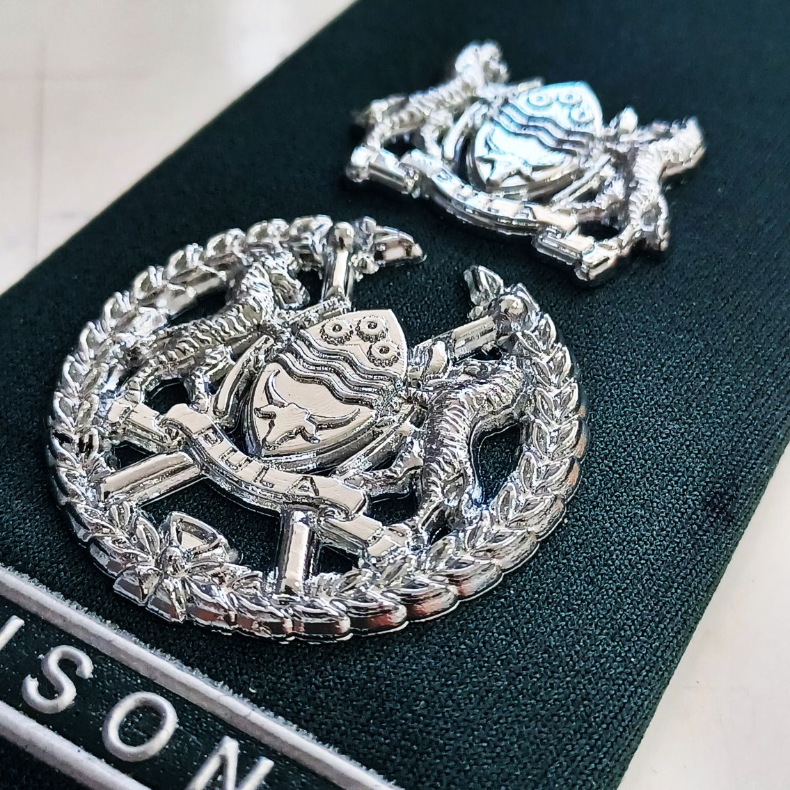 Metalette epaulette, shoulder flashes, name badges, embroidery, rank insignias, and more!